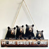 A wooden sign featuring four adorable black bears with paw prints, used as a rustic inspirational hanging sign.