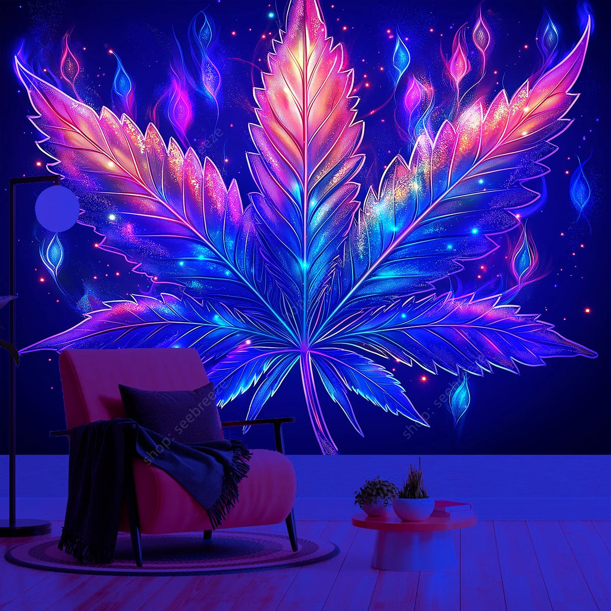 A vibrant neon cannabis leaf tapestry hangs above a pink armchair in a dark room.