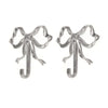 A pair of elegant brass bowknot wall hooks for home organization.