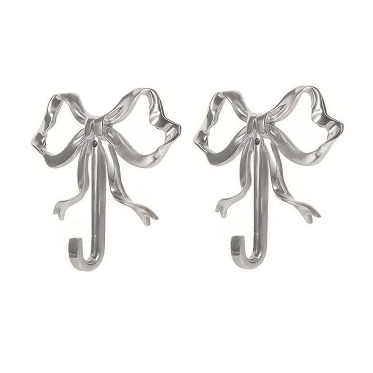 A pair of elegant brass bowknot wall hooks for home organization.