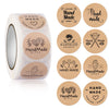 Roll of kraft paper hand made thank you stickers and round labels for small business packaging
