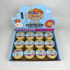 A box of colorful simulated dumpling squishy toys featuring a rainbow mystery theme.