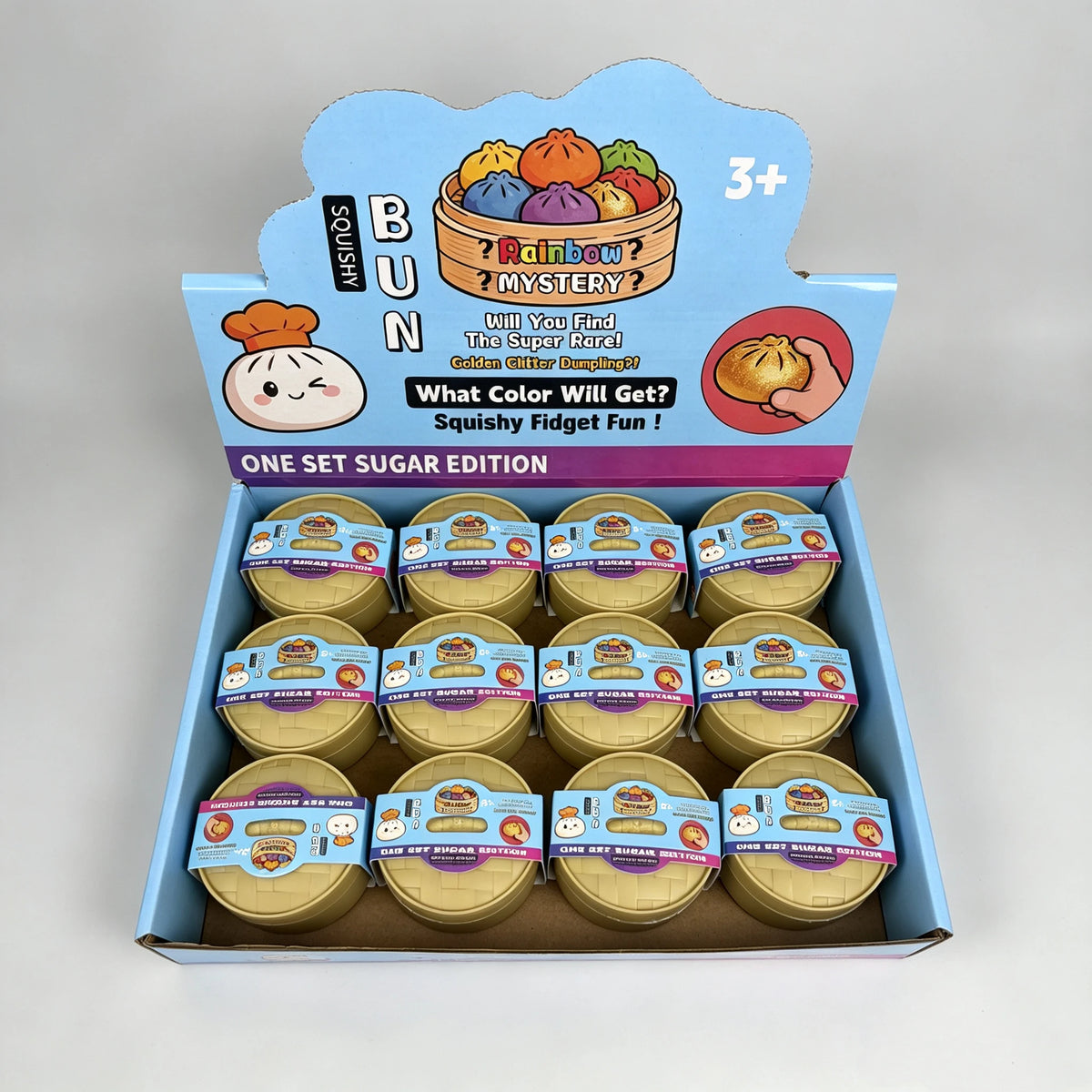 A box of colorful simulated dumpling squishy toys featuring a rainbow mystery theme.