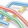 A close-up of flexible reusable drinking straws in various striped colors including red, white, blue, green, and yellow.