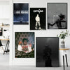 A gallery wall featuring three pieces of black and white artwork related to Playboi Carti's Opium era.