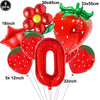 A set of red strawberry and number balloons including a 9 piece and a 0 balloon.