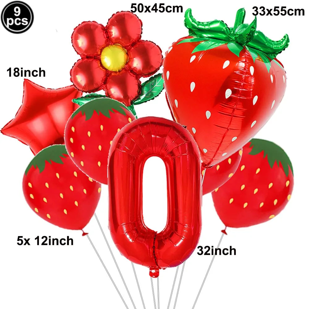 A set of red strawberry and number balloons including a 9 piece and a 0 balloon.