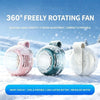 A pink, blue, and white portable bladeless fan is shown in a snowy outdoor setting.
