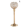 A golden crystal candle holder with a spherical glass shade and a slender stand.