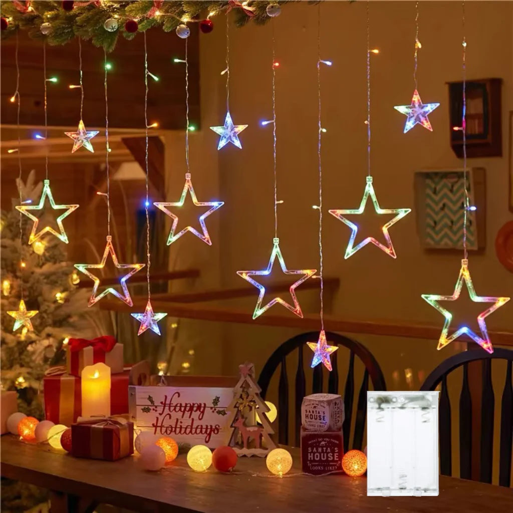 String lights featuring star and moon shapes hanging in a cozy room decor setting