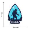 Blue embroidered patch featuring a silhouette of Bigfoot against a night sky with a crescent moon and the word BELIEVE.