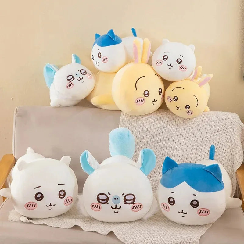 A collection of soft, round Chiikawa Hachiware anime plush pillows in various pastel colors and expressions.
