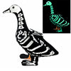 A black and white skeleton goose lawn decor with a luminous green glow.