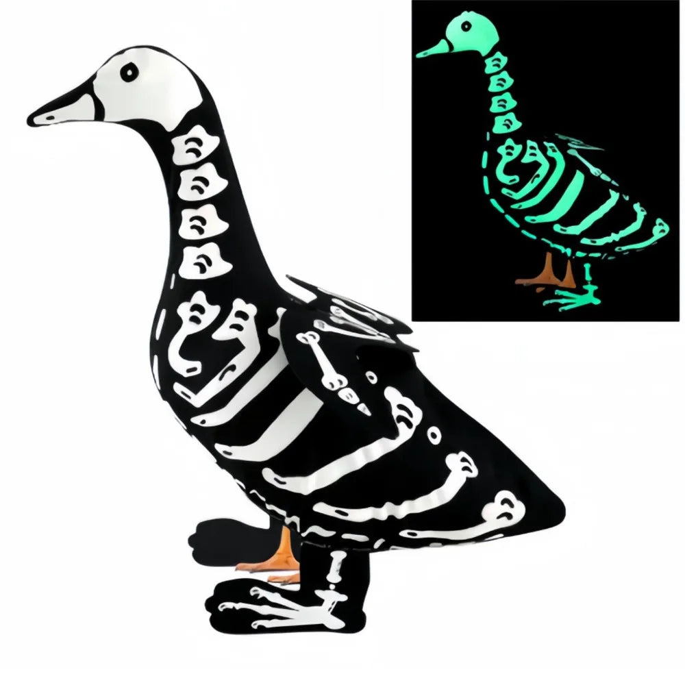 A black and white skeleton goose lawn decor with a luminous green glow.