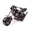 A handcrafted metal motorcycle model in a dark finish, displayed against a white background.