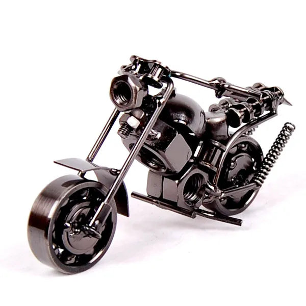 A handcrafted metal motorcycle model in a dark finish, displayed against a white background.