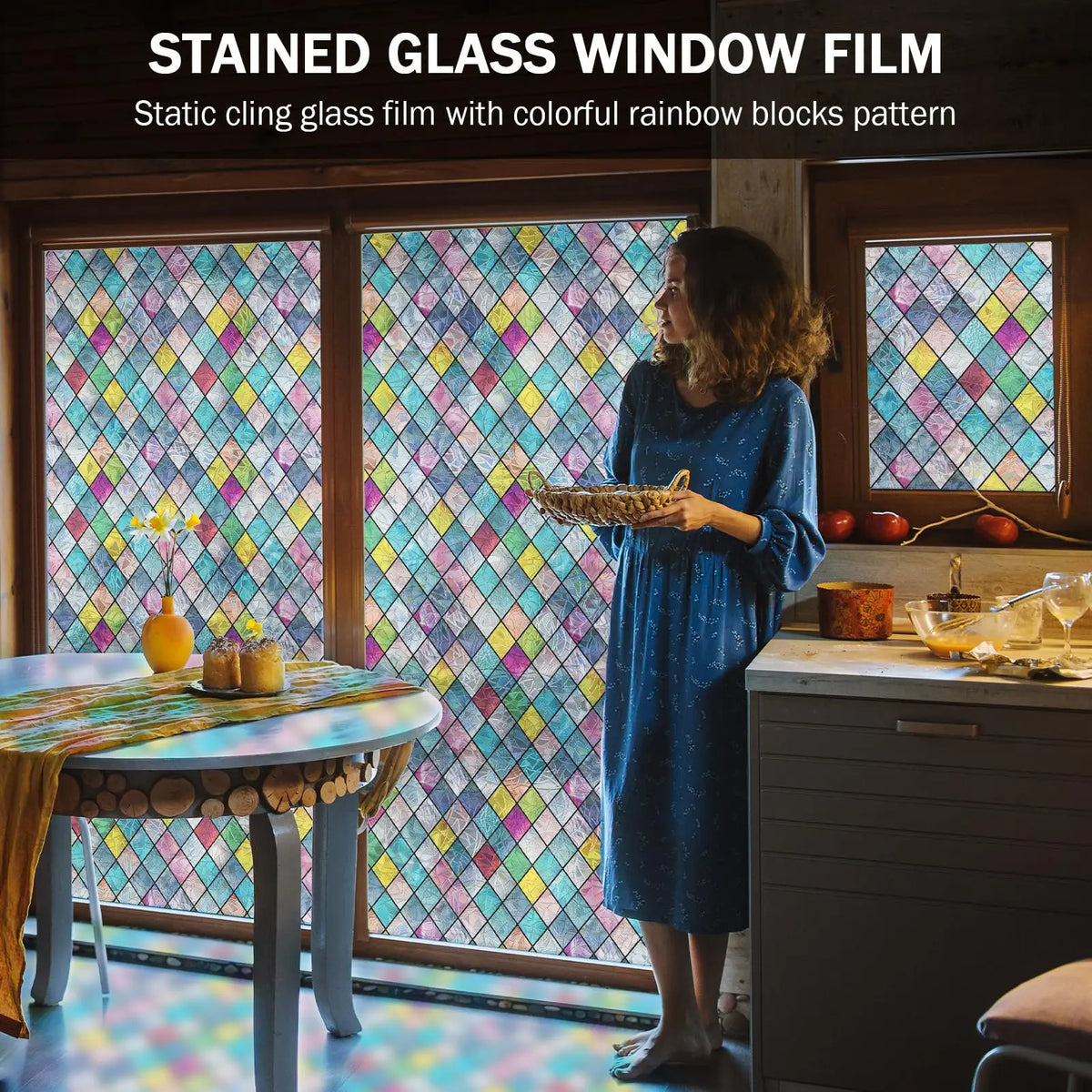 A woman stands in front of a window covered with stained glass film featuring colorful rainbow blocks, illuminating an interi