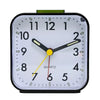 A white analog alarm clock face with black markings and yellow hands displaying the time.