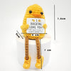 Handmade crochet yellow potato doll with a sign that reads I DUCKING LOVE YOU