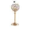 A crystal candle holder with a golden finish featuring a spherical, textured glass design.