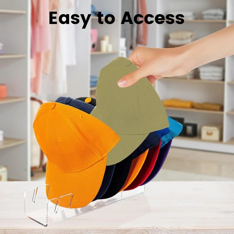 A hand is easily accessing a colorful acrylic hat storage rack filled with various colored hats.