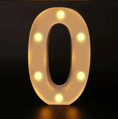 A luminous LED alphabet night light shaped like the number zero, glowing with warm white light.
