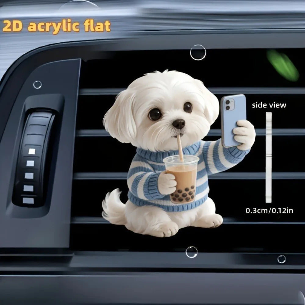 A white acrylic teddy bear puppy is shown holding a drink and a smartphone, placed inside a car vent.