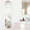 A vertical acrylic mirror wall decal with a rounded top, featuring frosted glass panels and a small decorative tree.
