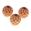 A set of natural wooden checkered beads used for jewelry making.