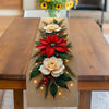 A rectangular glass table runner featuring a festive poinsettia design with white roses and green foliage.