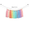 Handmade boho rainbow tassel garland featuring wooden beads in various pastel colors