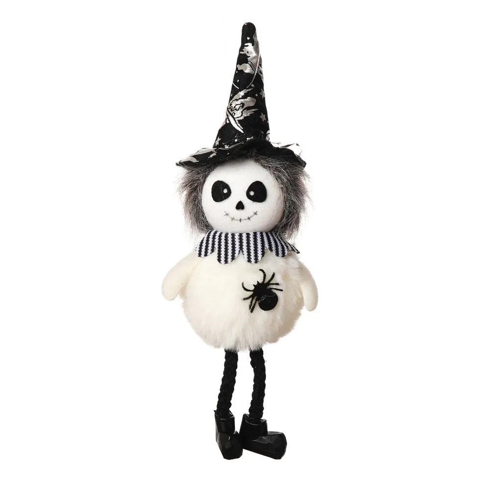 A Halloween ornament featuring a witch hat and scarecrow-like face with black hair and a spider detail.
