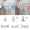 Decorative birthday garland featuring letters and numbers in white and pink ribbon for a first birthday celebration