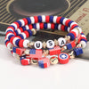 A set of patriotic American flag beaded stretch bracelets featuring red, white, and blue colors.