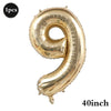 A large, gold foil number balloon shaped like the number 9 for birthday and party decoration.
