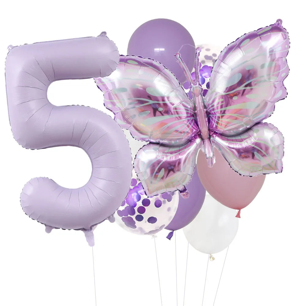 A set of purple foil balloons shaped like the number five and a butterfly