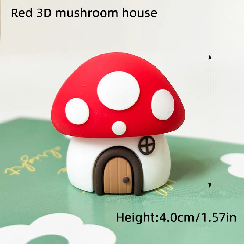A red 3D mushroom house cake topper with white polka dots and a small wooden door.