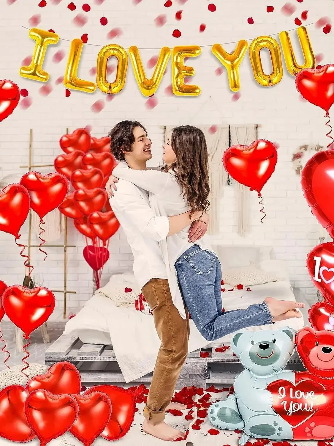 A set of red heart balloons and a blue bear decoration for a romantic theme.