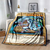 A throw blanket featuring a graphic of the Blue-Eyes White Dragon from Yu-Gi-Oh!