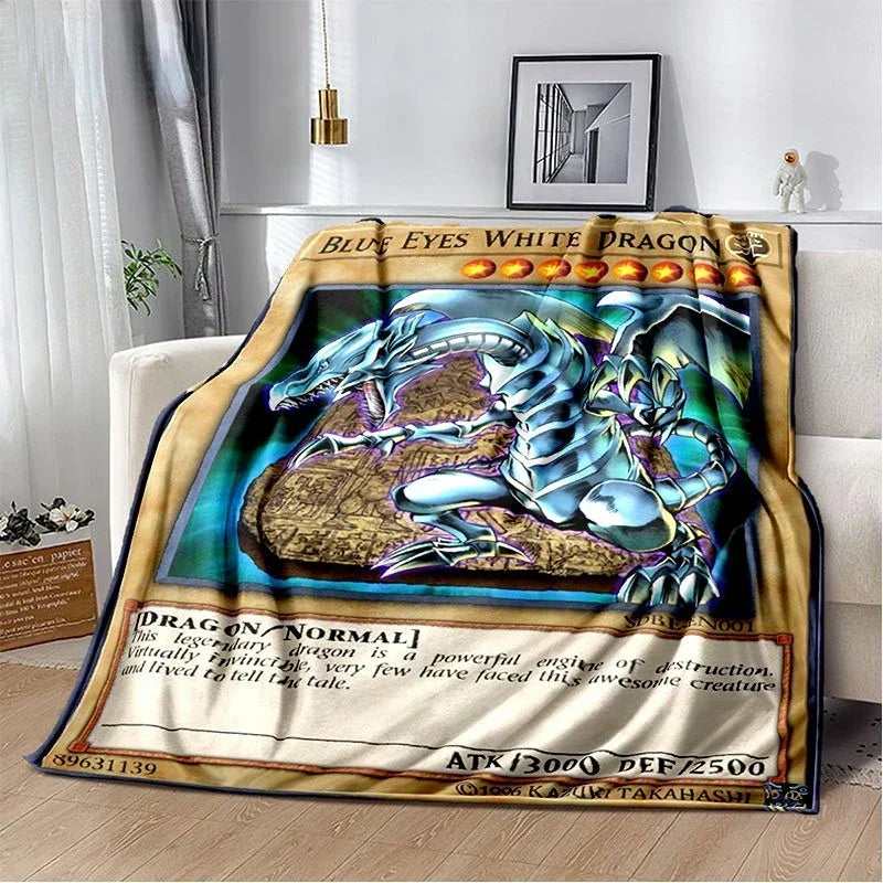 A throw blanket featuring a graphic of the Blue-Eyes White Dragon from Yu-Gi-Oh!