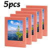 Five pink magnetic photo frames with scenic landscape images displayed in glass panels.