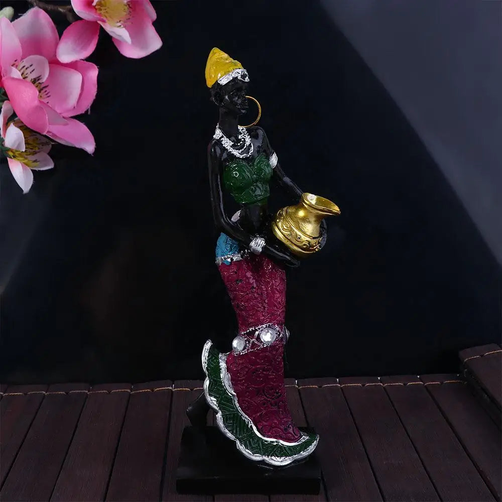 Hand-painted resin statue of an African tribal lady with gold jewelry and a golden pot
