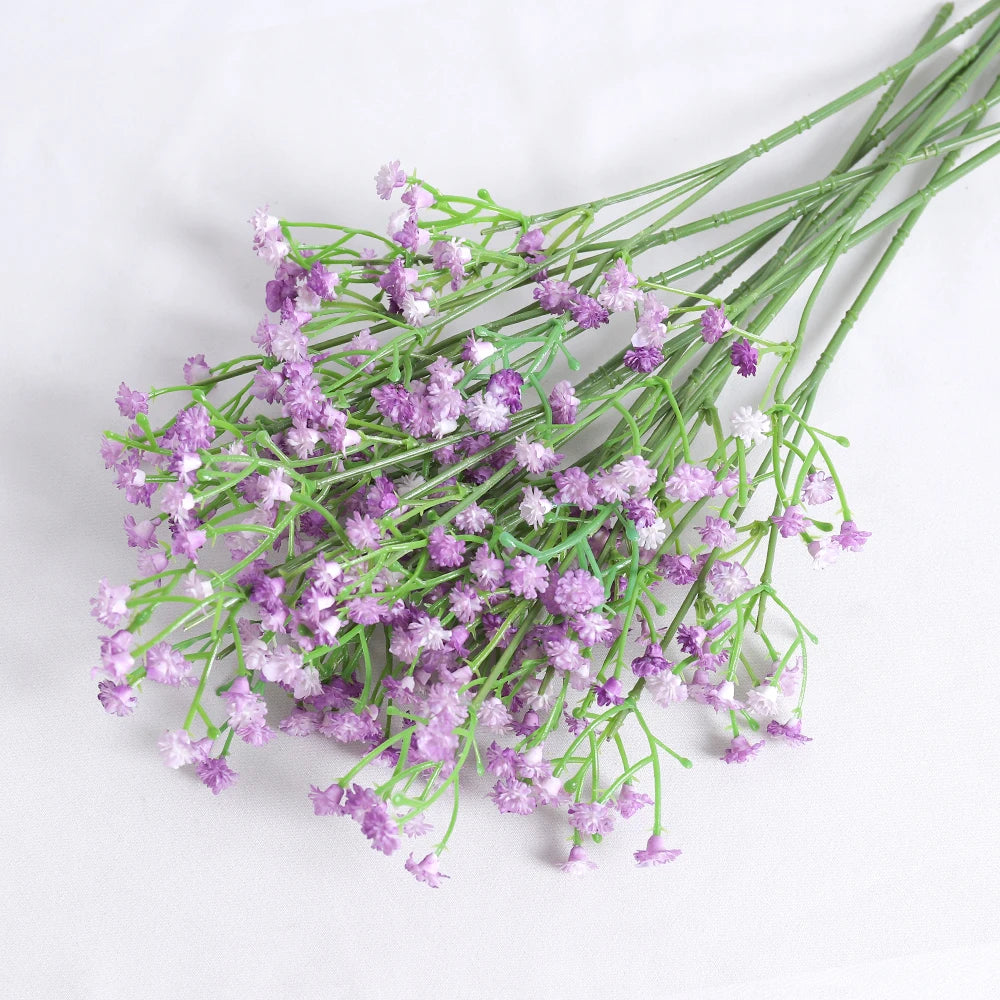 A bunch of artificial baby's breath flowers in shades of purple and white.