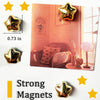 A set of gold star fridge magnets displayed next to a photo, showing their size and quality.