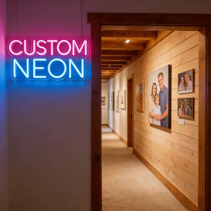 A custom neon sign spelling CUSTOM NEON is displayed on a white wall next to a wooden doorway.