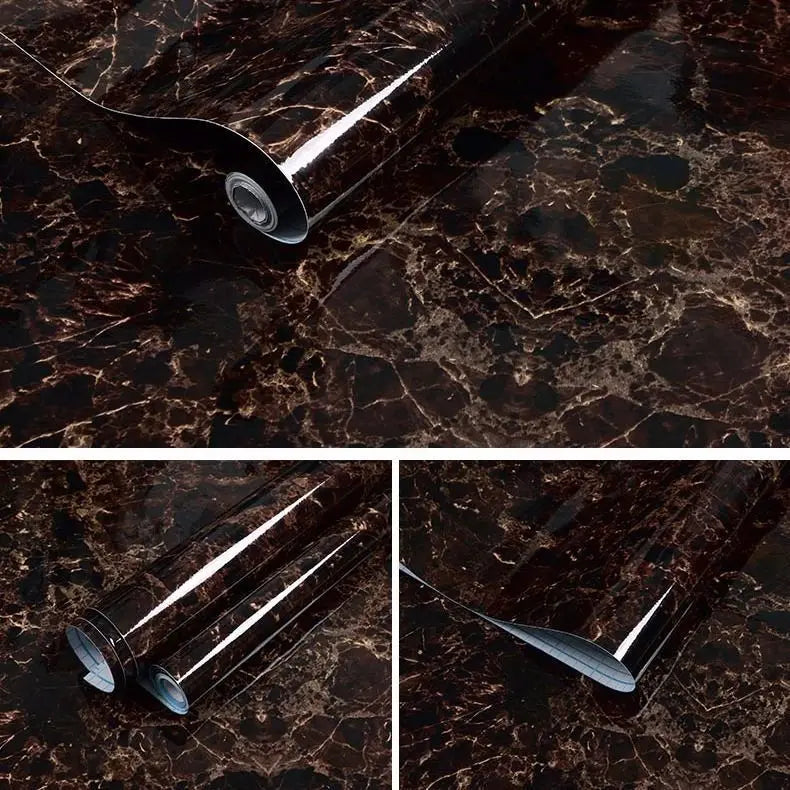 Close-up view of a silver self-adhesive marble contact paper being applied to a dark brown marble surface.