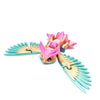 A pink and teal articulated 3D printed owl figurine with spread wings.
