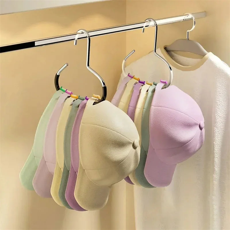 A display of colorful circle ring hats hanging from a metal hanger on a rack.
