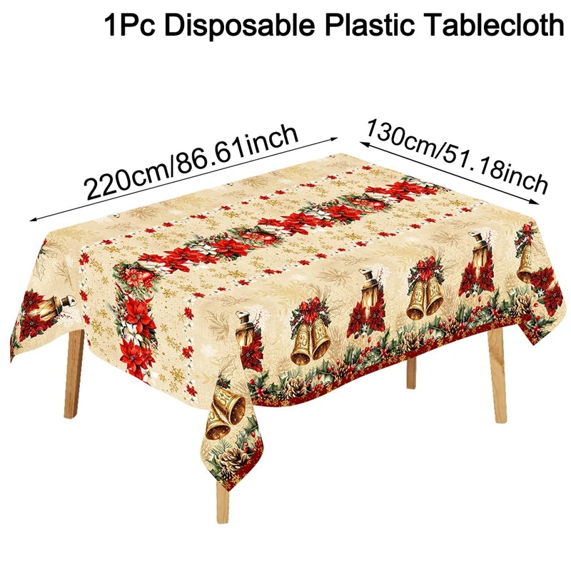 A beige disposable plastic tablecloth featuring a vintage Christmas design with red poinsettias and brass bells.