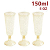 Three clear plastic champagne flutes with gold glitter detailing shown against a white background.